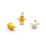 DIJE POLLITO AMARILLO EN CASCARÓN DE HUEVO POLLO
