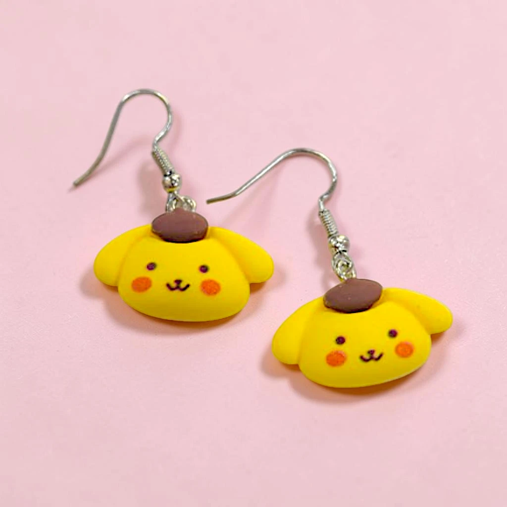 WhatsApp Image 2026-06-10 at 11.49.55 AM (2) ARETES LOCOS DE PERSONAJES PERRO AMARILLO - Image 1