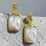 aretes maxi de perla con dorado