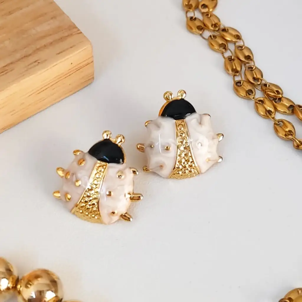 yigo aretes de acero inoxidable blanco con dorado Catarina - Imagen 1