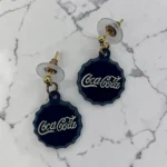 aretes de tapa de refresco negra