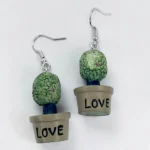 aretes con diseño de arbusto en maceta