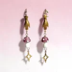aretes colgantes de hongo, manos y estrellas