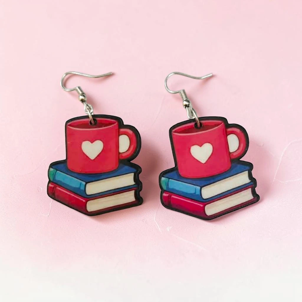 WhatsApp Image 2026-10-08 at 12.22.45 PM (2) (1) aretes de libros y taza - Imagen 1