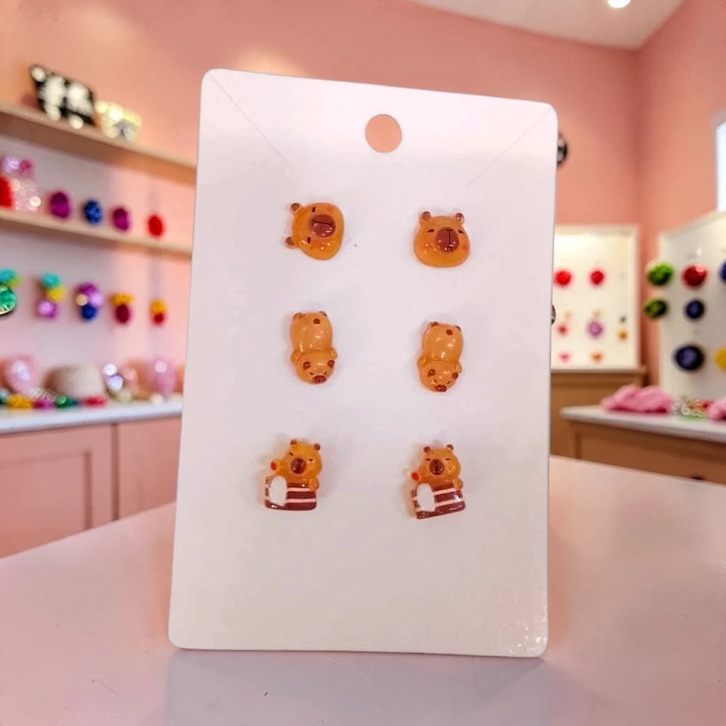 WhatsApp Image 2026-10-10 at 8.01.15 PM ARETES DE MADERA PACK 3 CAPIBARA - Imagen 1