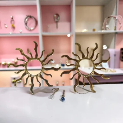 ARETES DE ACERO SOL RAYOS DORADOS