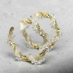 ARETES ARRACDAS DORADAS CON PIEDRERIA DE ACERO