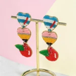 aretes de maestra de lapiz, manzana, goma